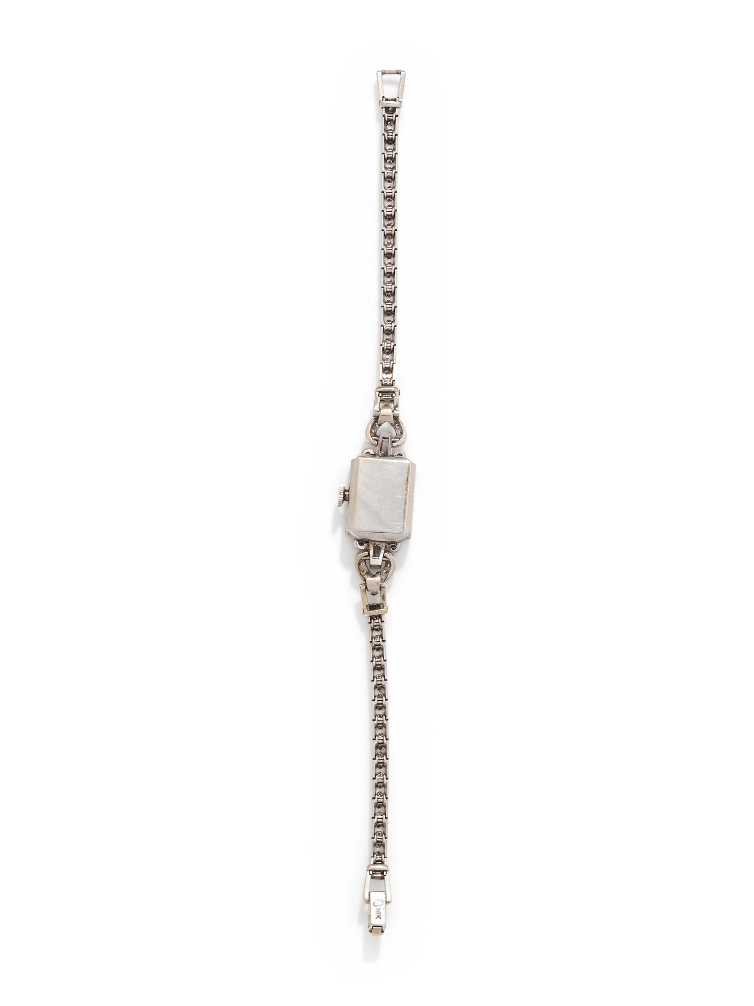 MOVADO, WHITE GOLD AND DIAMOND WRISTWATCH