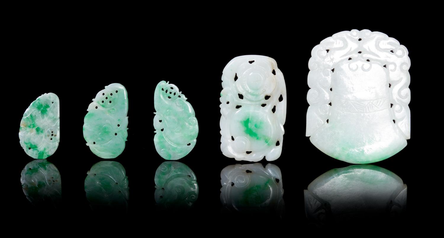 Five Pierce Carved Jadeite Pendants Height of largest 2 1/8 inches.