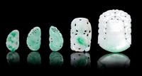 Five Pierce Carved Jadeite Pendants Height of largest 2 1/8 inches.