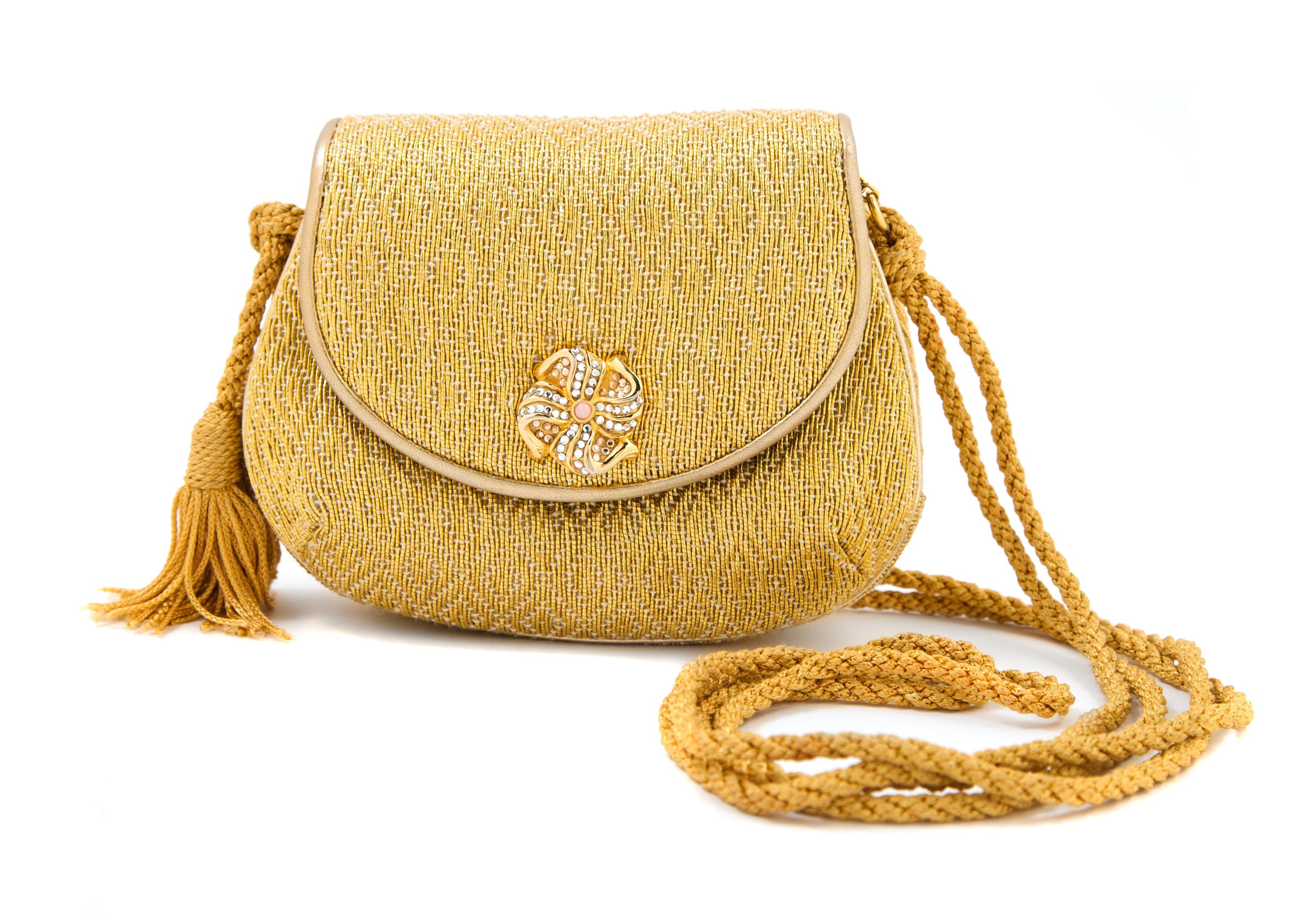 A Judith Leiber Gold Woven Fabric Clutch, 5.5" x 4.5" x 1.5".
