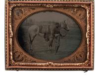 [CIVIL WAR]. Quarter plate tintype featuring a Union cavalryman with his horse.