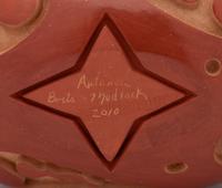 Polished and Carved Redware Pottery Vessel, with stars and swirls