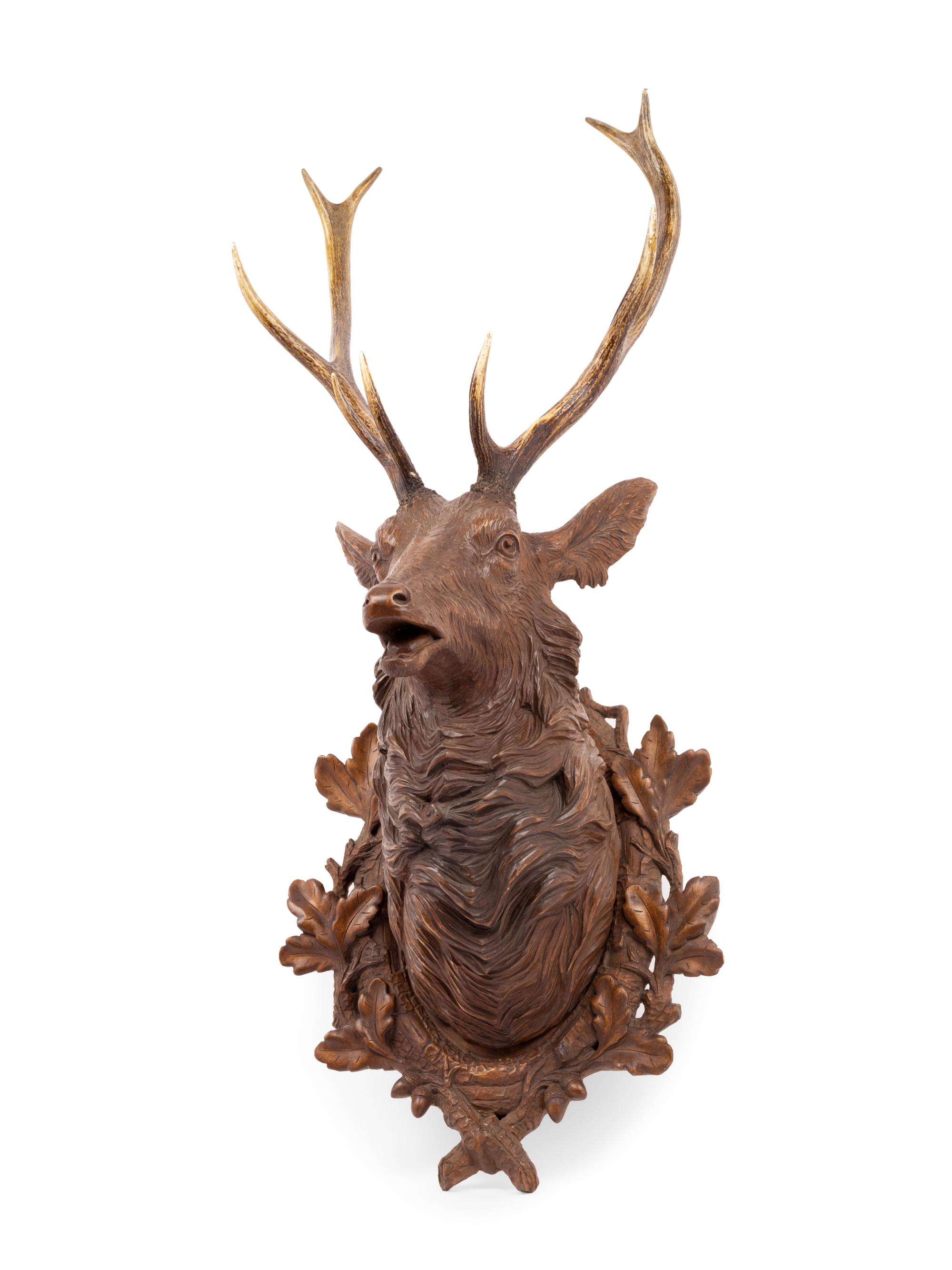 A Black Forest Carved Stag Head