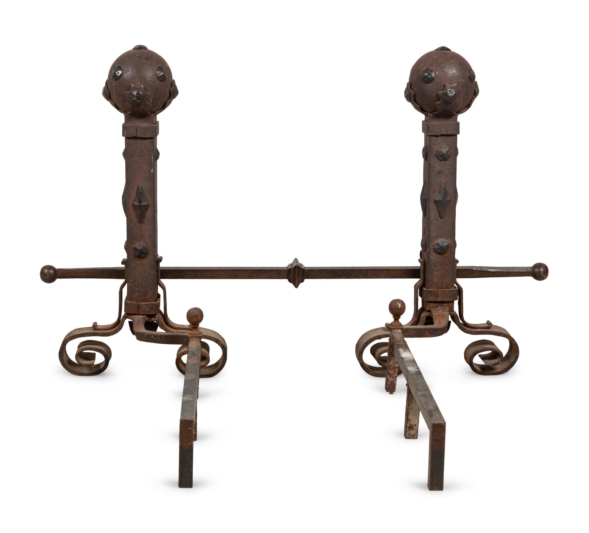 A Pair of Continental Gothic Style Iron Andirons