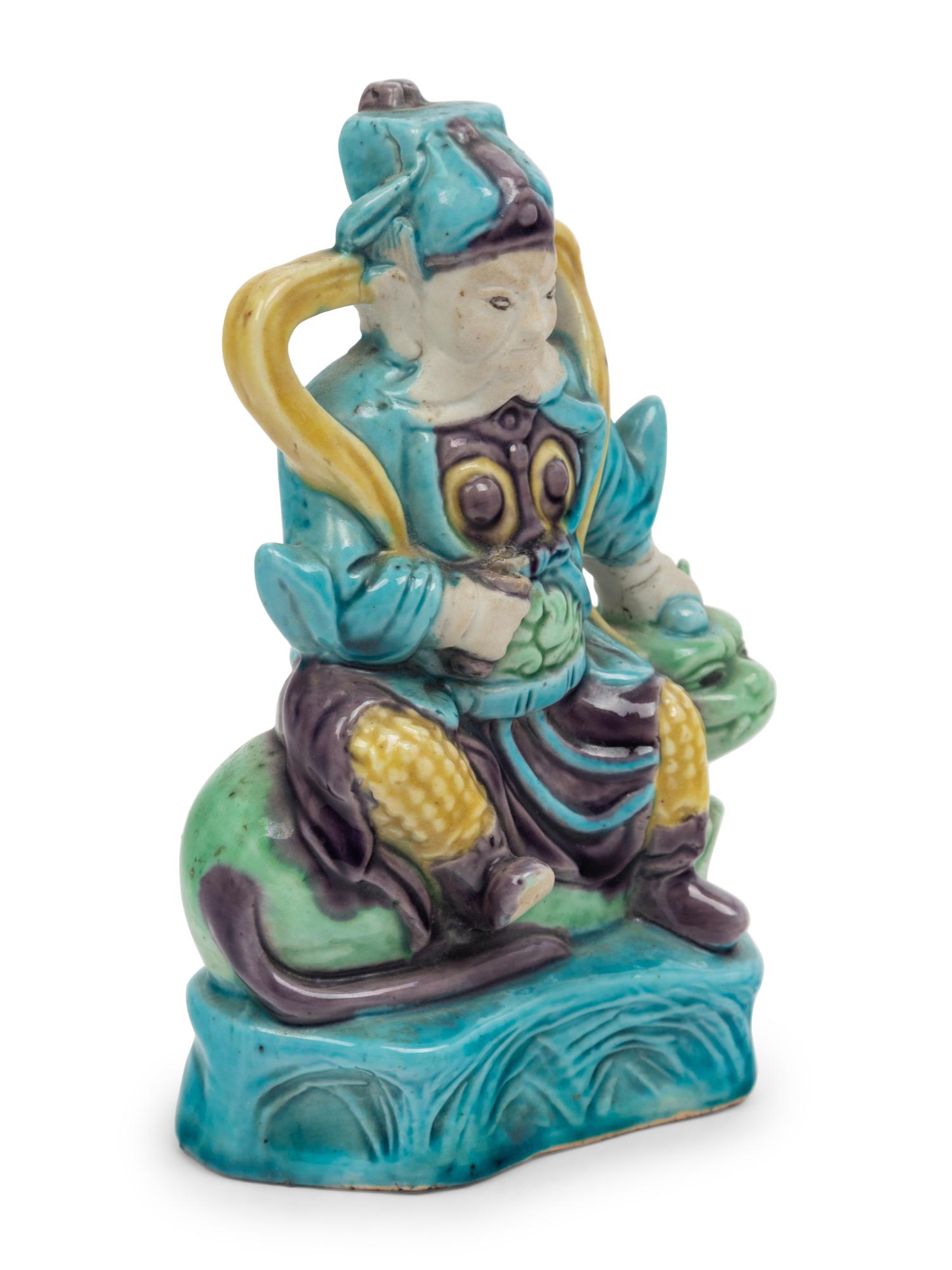 A Chinese Sancai Glazed Porcelain Figure