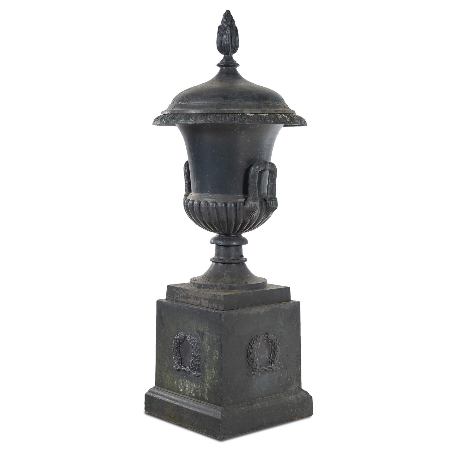 A Cast Iron Garden Urn and Pedestal