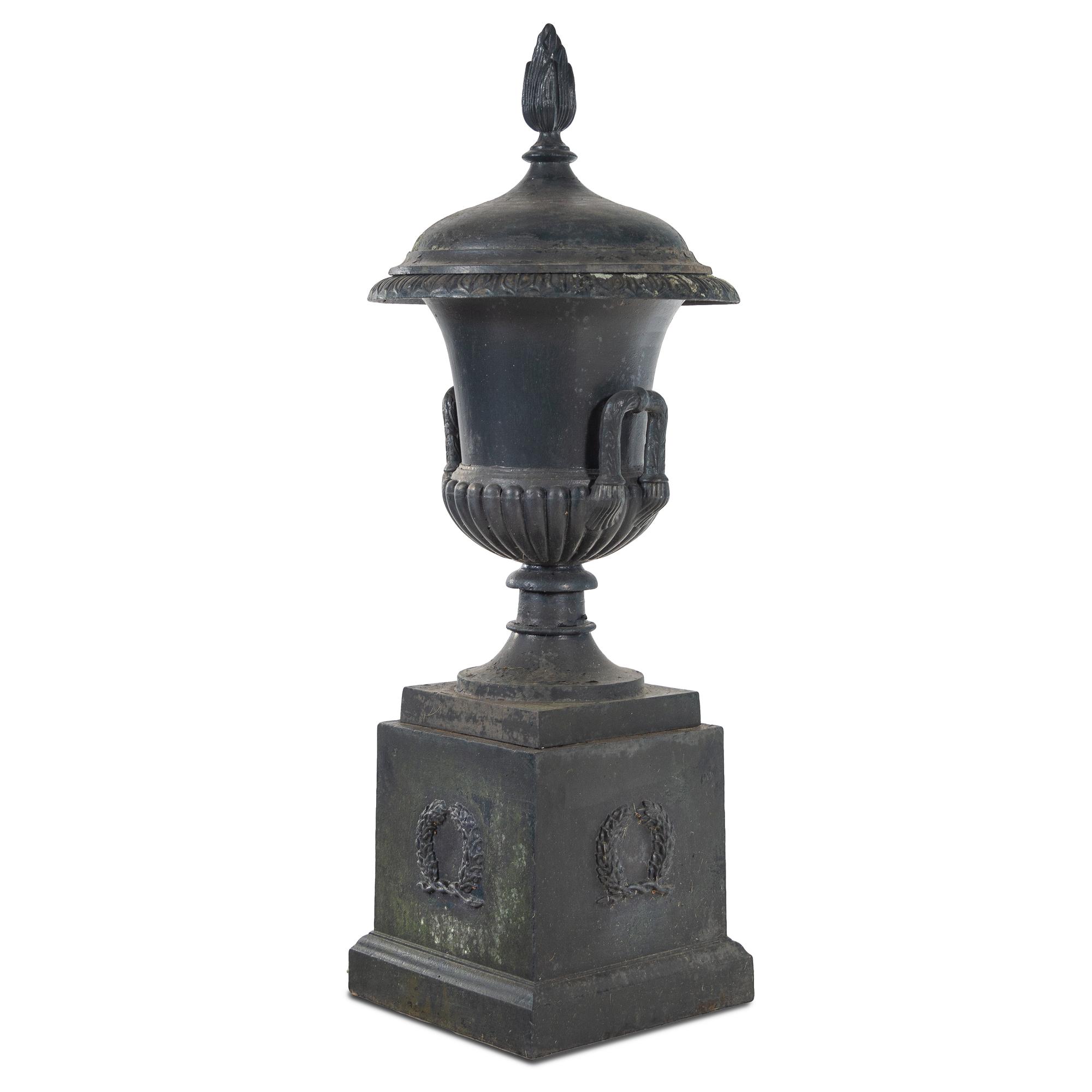 A Cast Iron Garden Urn and Pedestal