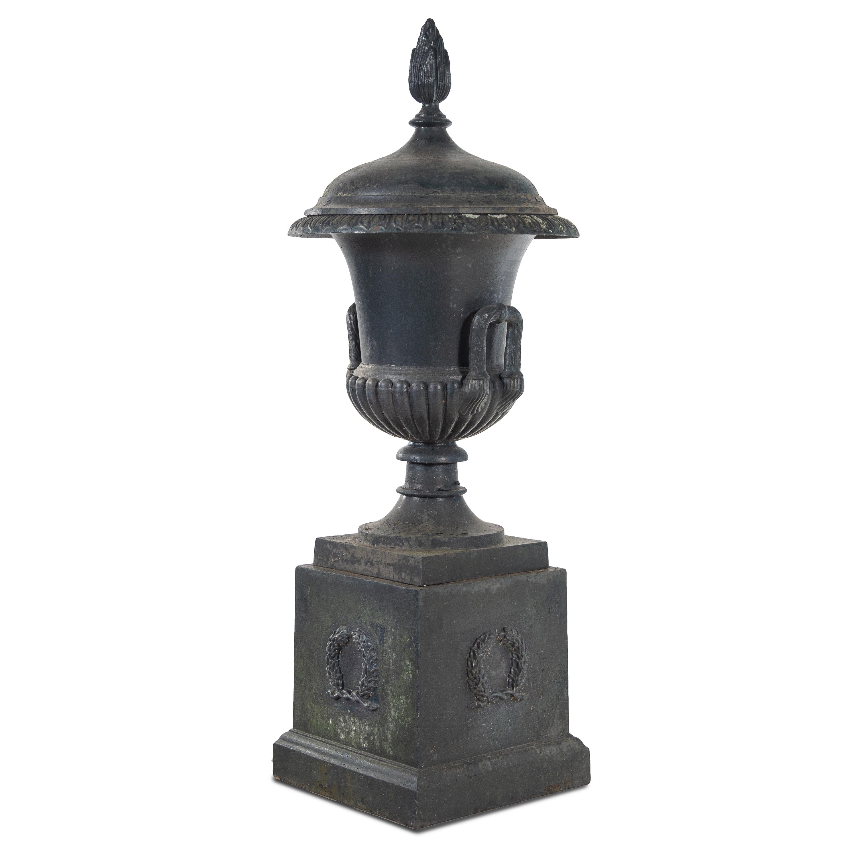 A Cast Iron Garden Urn and Pedestal