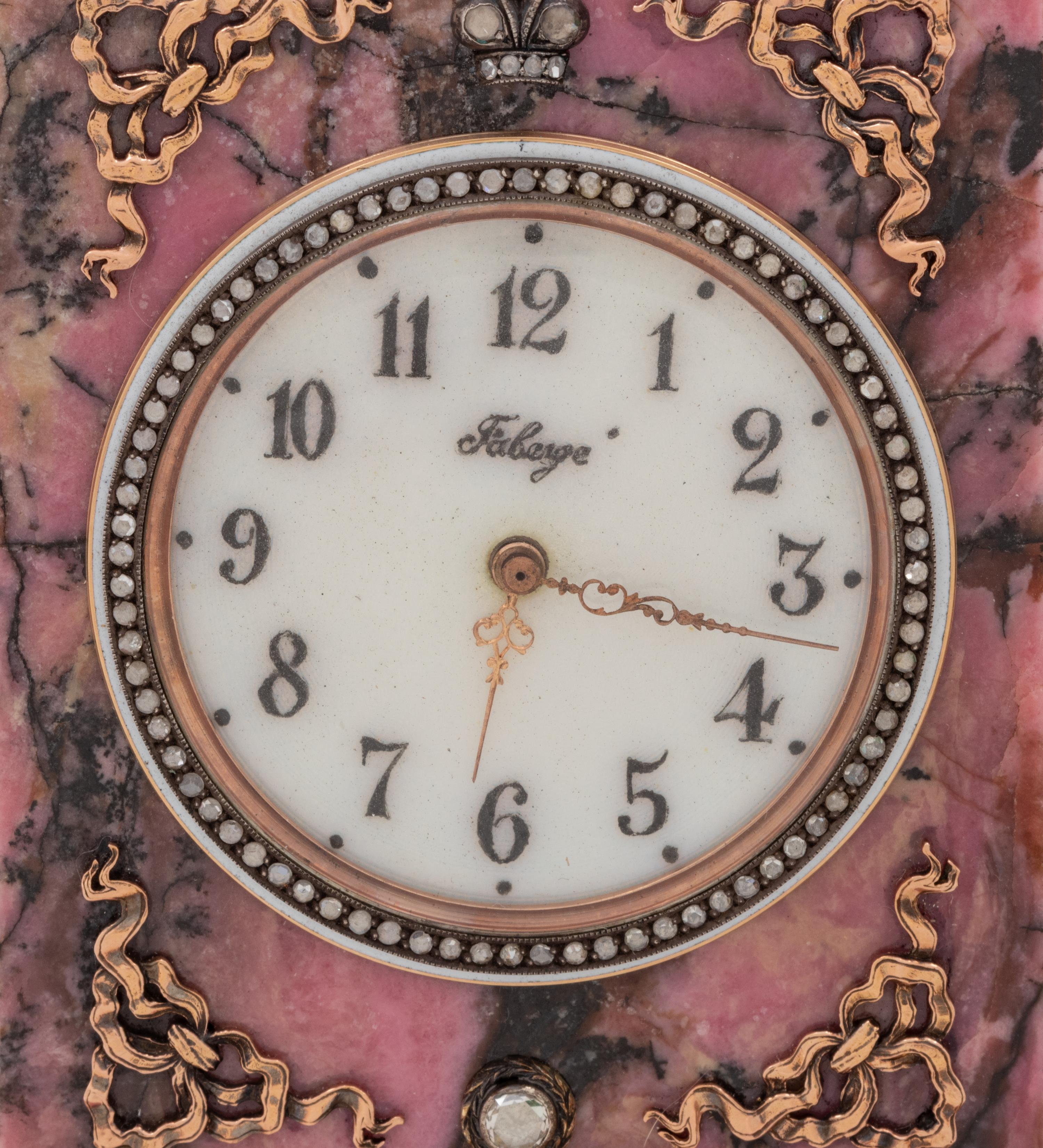 A Carved Hardstone, Enamel, 14-Karat Gold and Hardstone Mounted Three-Piece Clock Garniture