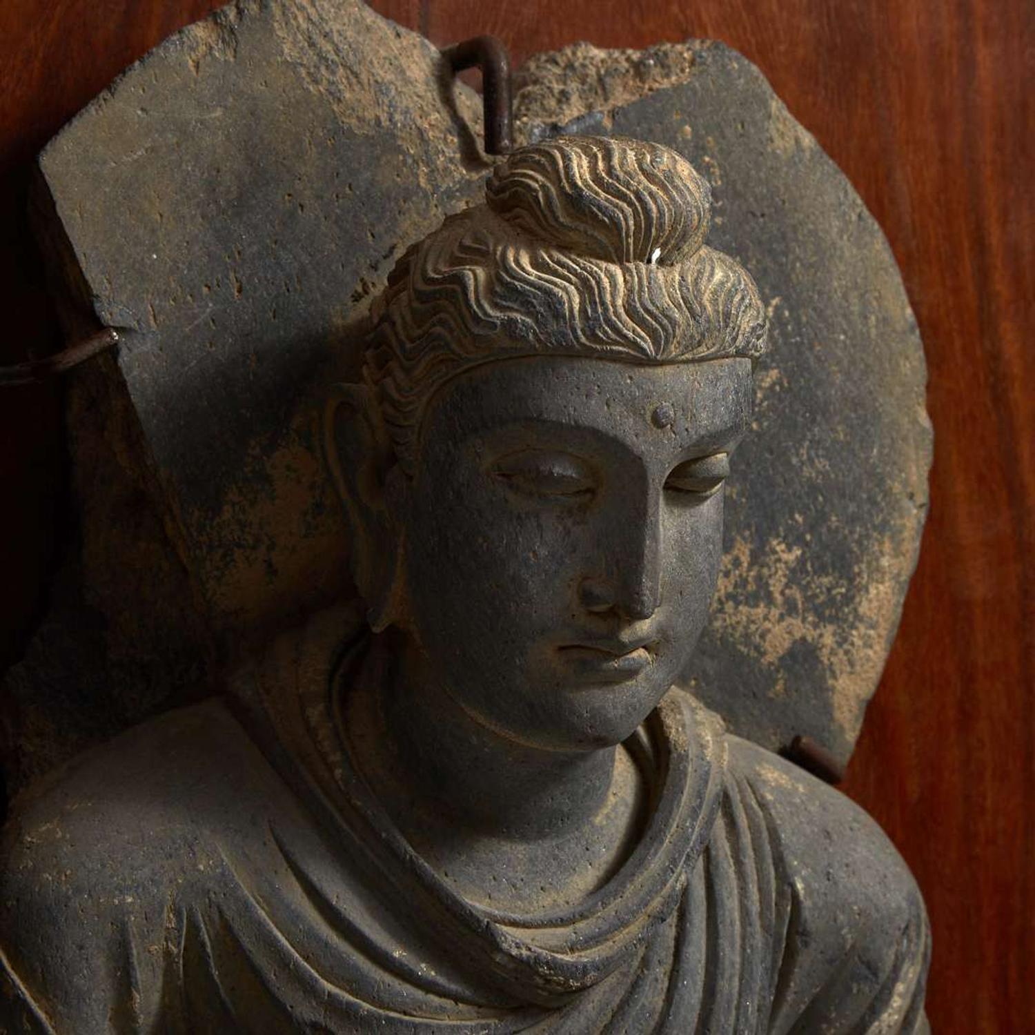 A carved schist figure of the seated Teaching Buddha, Ancient region of Gandhara, 2nd-3rd century 灰片岩雕像坐像 古犍陀羅地區，二至三世紀