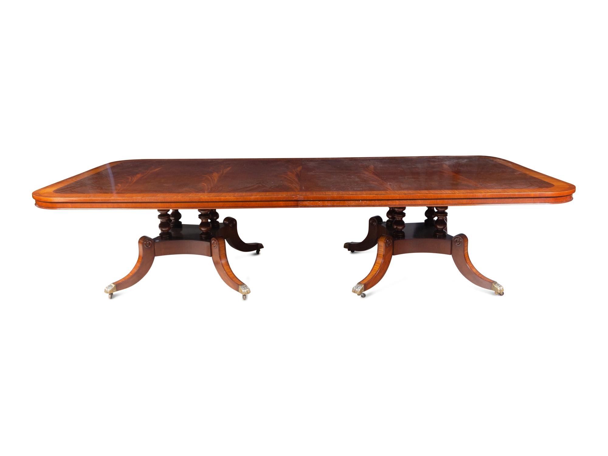 A George III Style Satinwood-Banded Mahogany Triple-Pedestal Dining Table