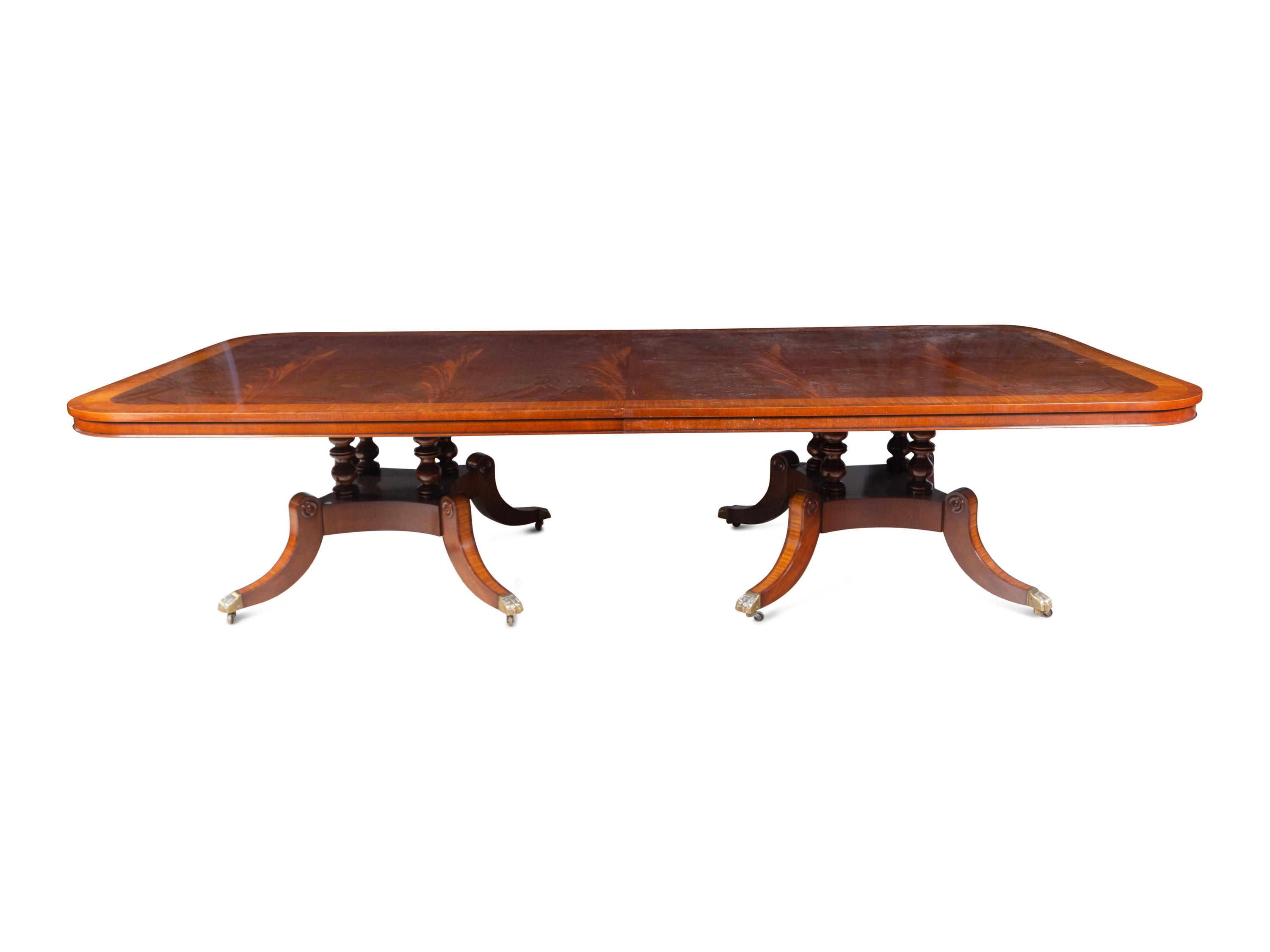 A George III Style Satinwood-Banded Mahogany Triple-Pedestal Dining Table