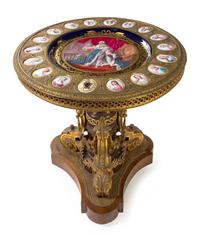 A Louis XVI Style Gilt Bronze and Sevres Porcelain Mounted Gueridon Height 32 1/4 x diameter of top 31 inches. — 19TH CENTURY