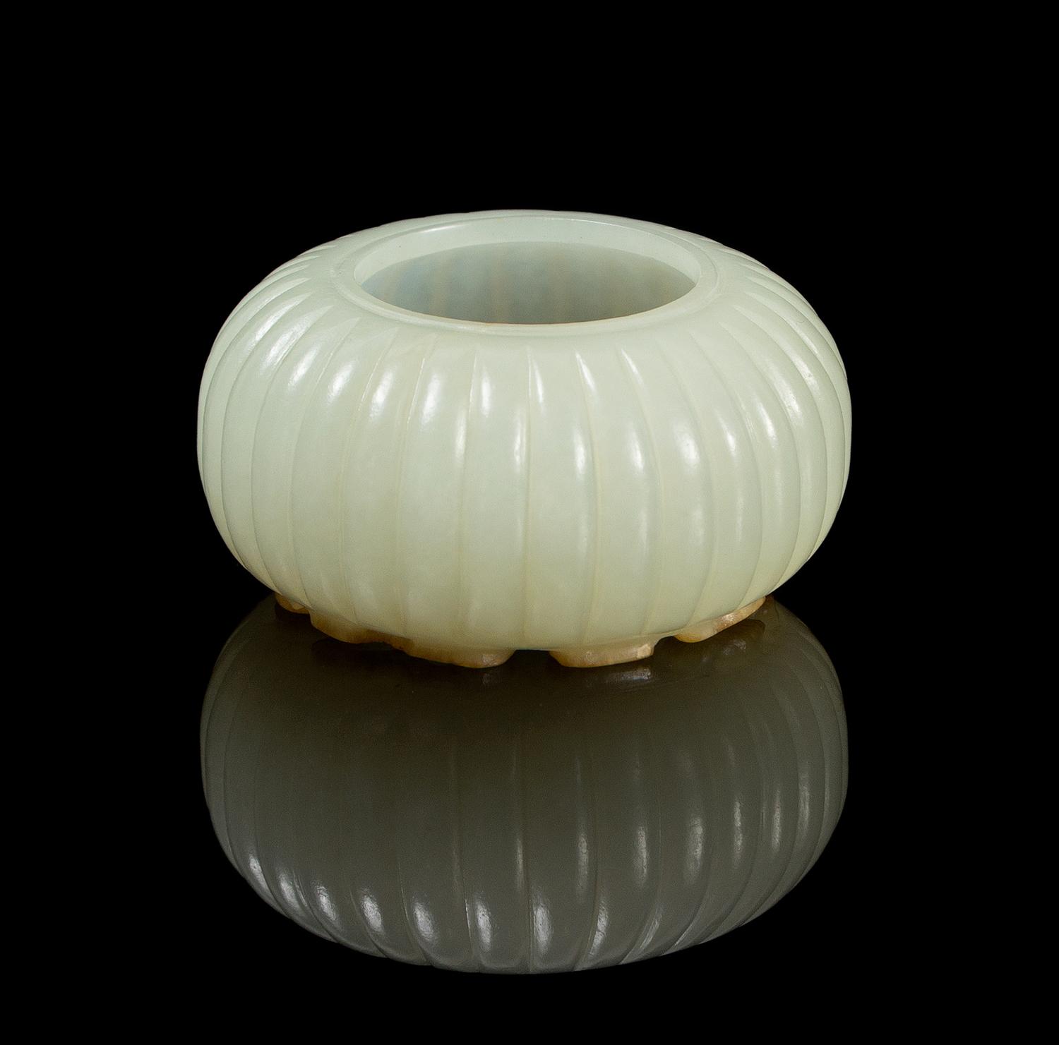 A Chinese Light Celadon Jade Fluted Water Pot 18TH/19TH CENTURY Diameter overall 2 1/8 inches. — 18TH/19TH CENTURY