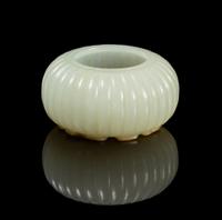 A Chinese Light Celadon Jade Fluted Water Pot 18TH/19TH CENTURY Diameter overall 2 1/8 inches. — 18TH/19TH CENTURY