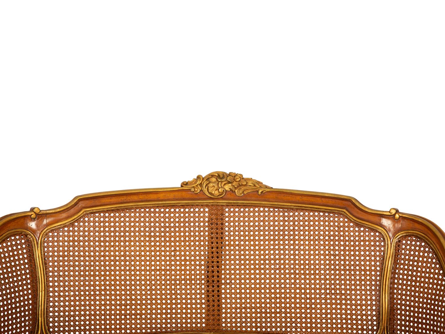 A Pair of Louis XV Style Stained and Giltwood Settees