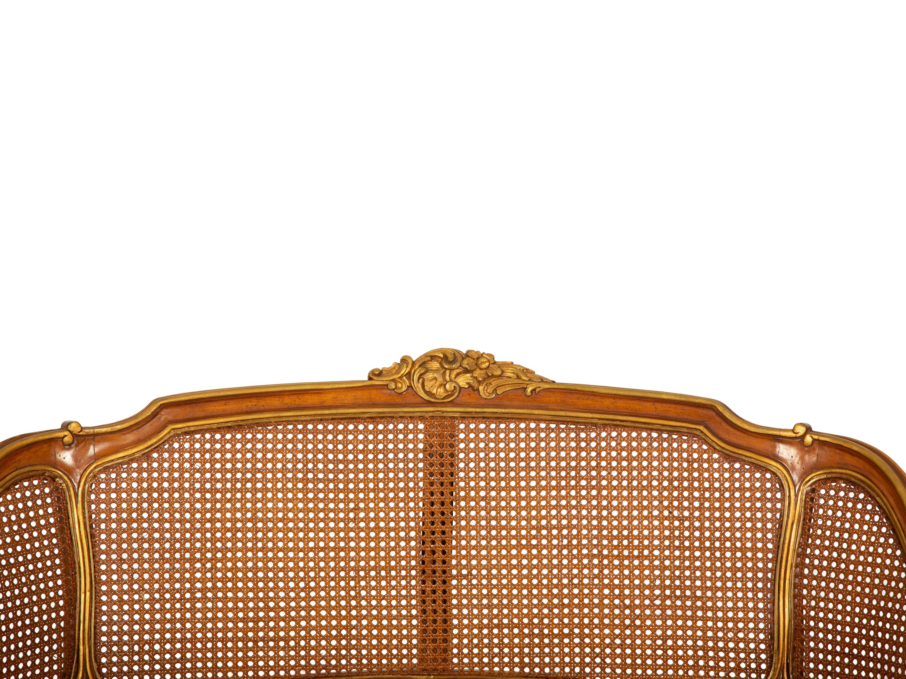 A Pair of Louis XV Style Stained and Giltwood Settees