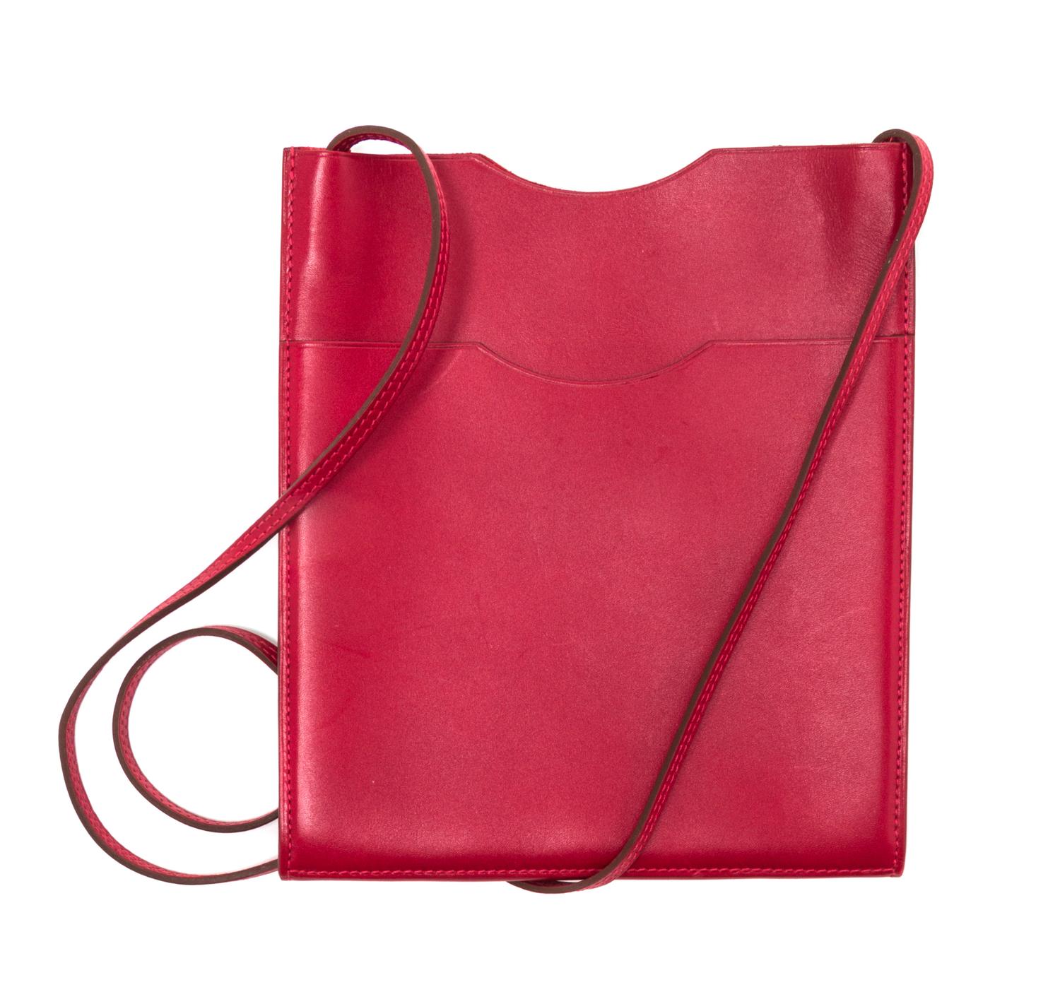 An Hermes Rouge Leather Passport Pouch, 7" x 8" x 1".