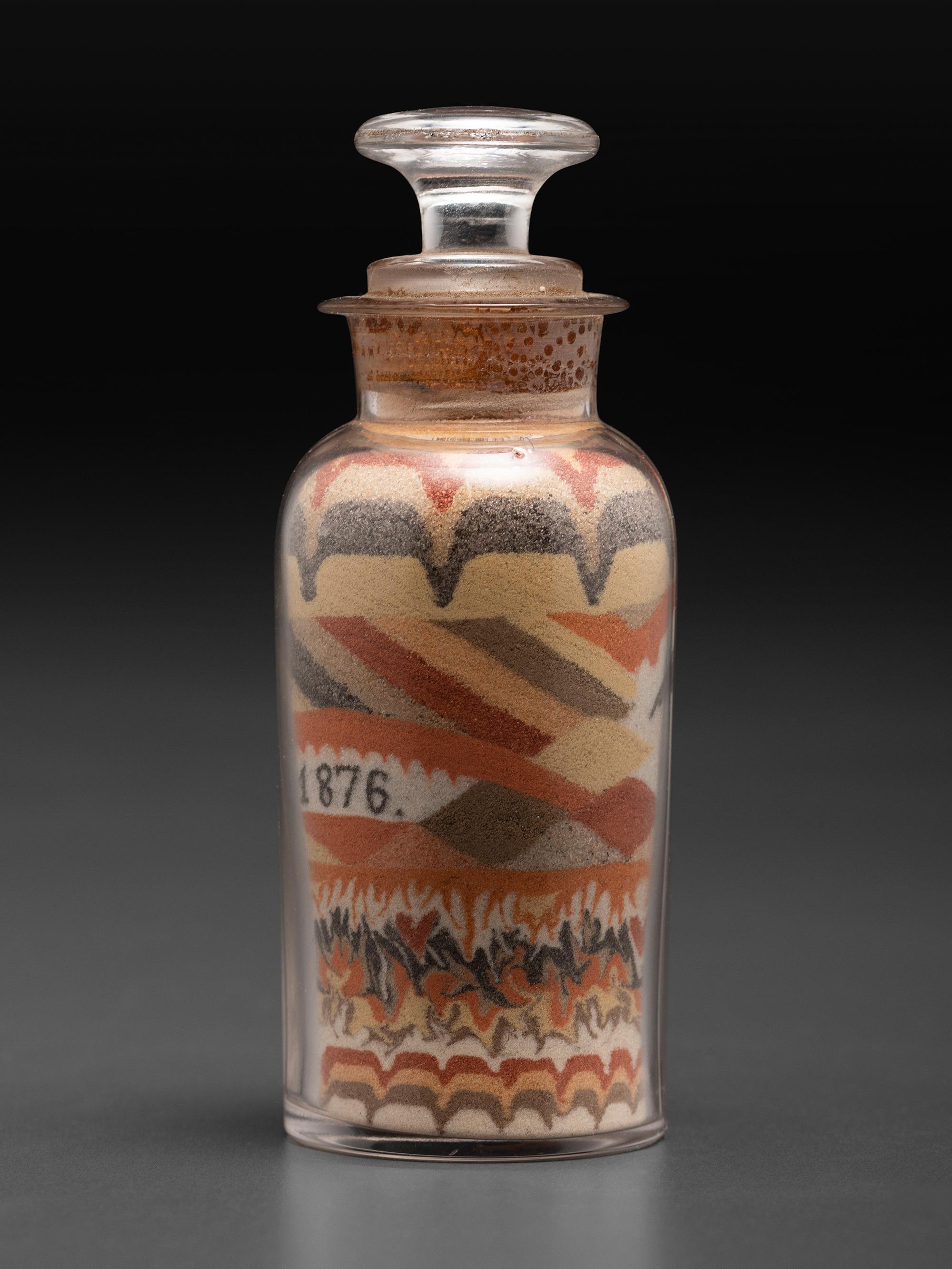 An Early Andrew Clemens (American, 1857-1894) Eagle Sand Bottle