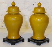 A Pair of Chinese Yellow Glazed Porcelain Covered Vases. Height 17 1/2 inches.