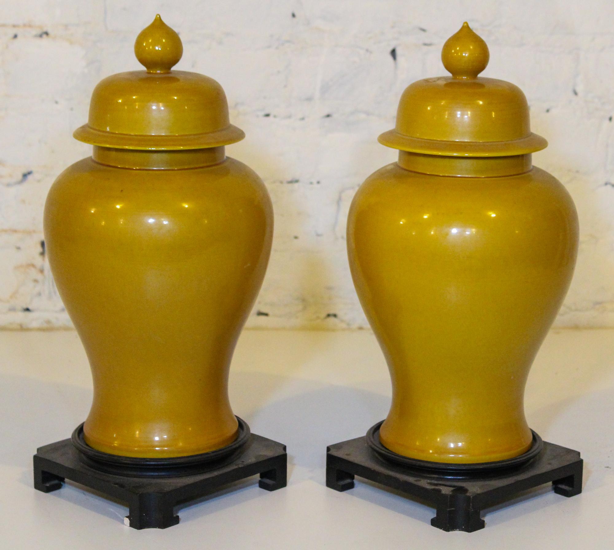 A Pair of Chinese Yellow Glazed Porcelain Covered Vases. Height 17 1/2 inches.