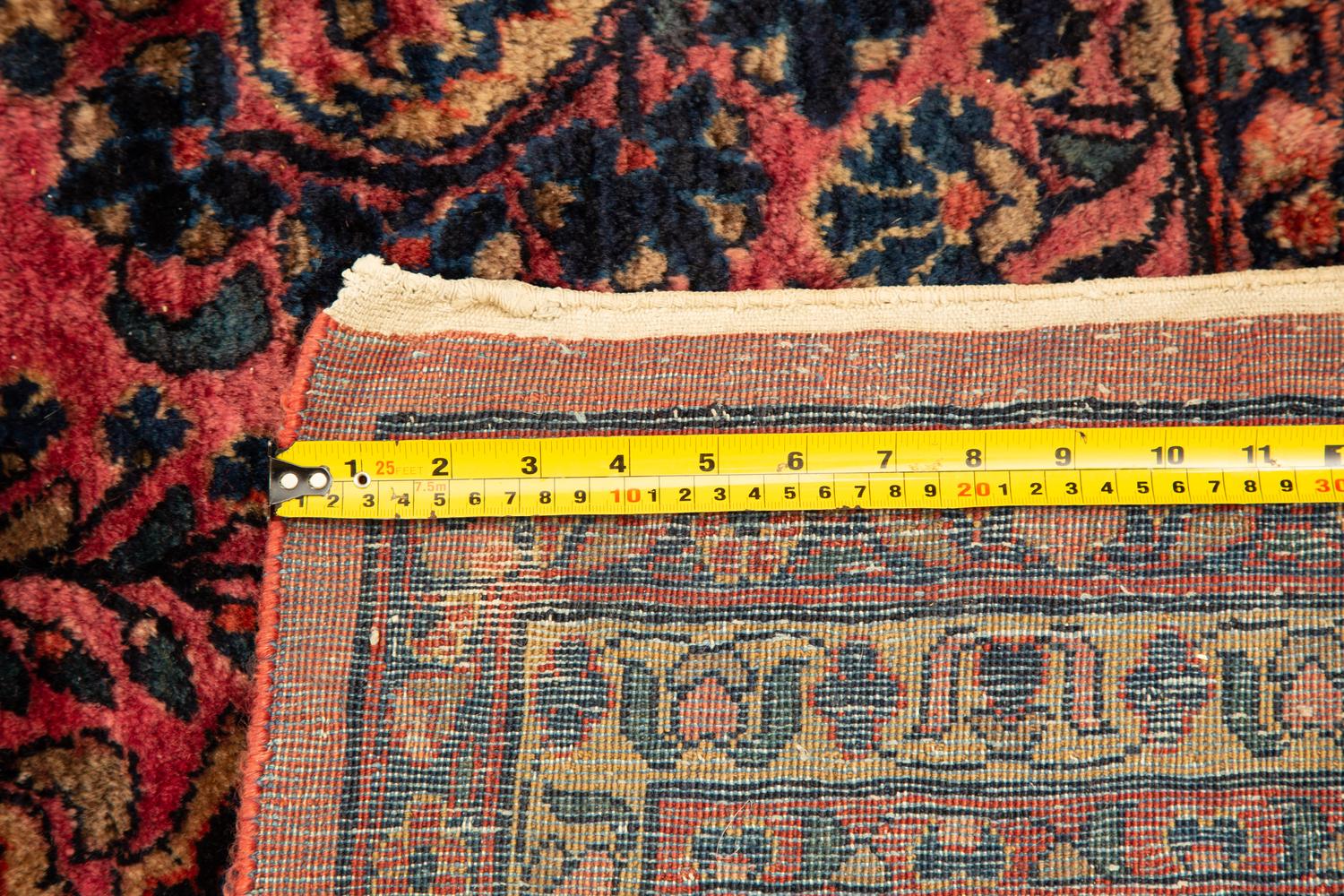 A Sarouk Wool Rug — 20th Century