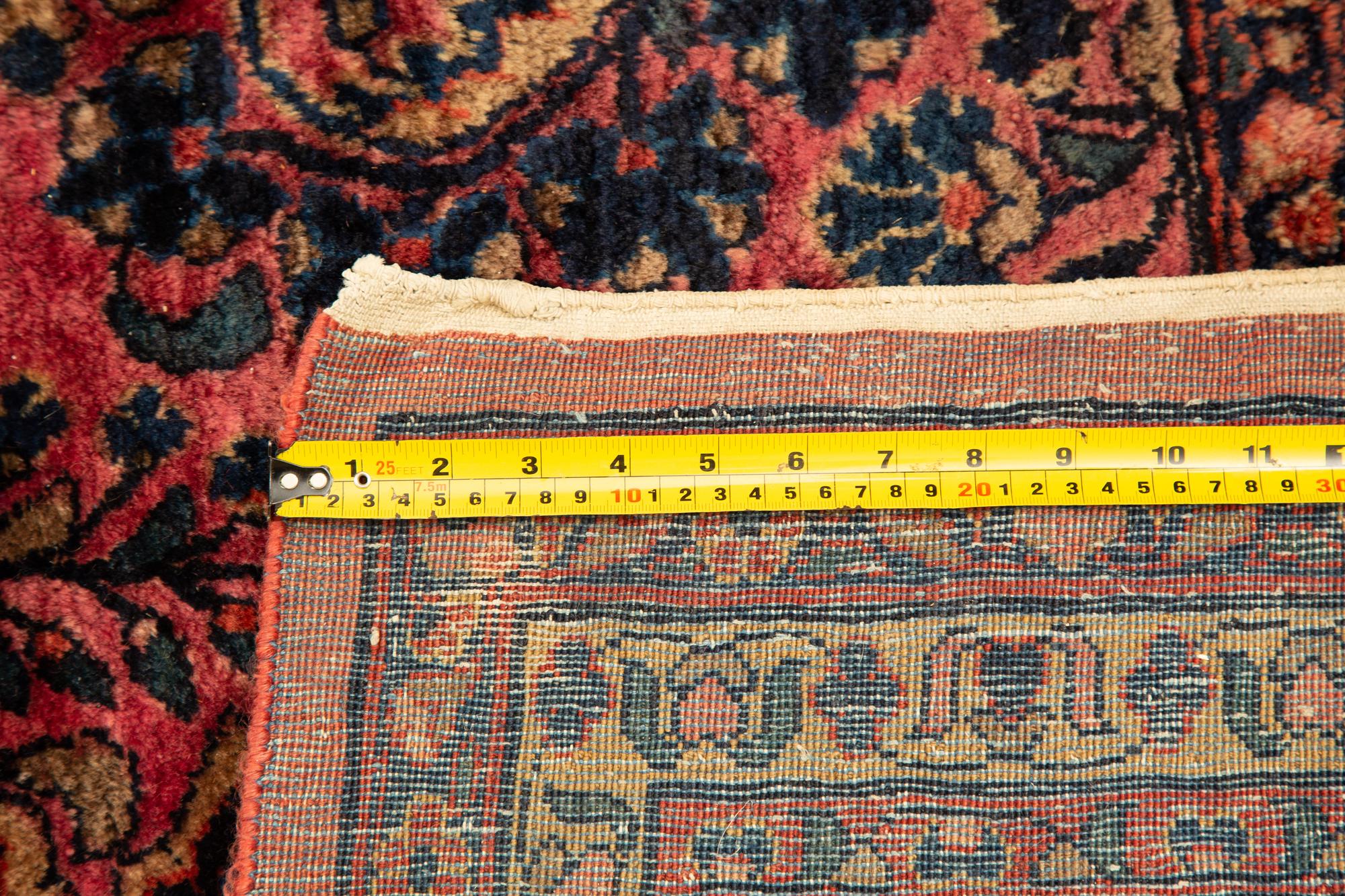 A Sarouk Wool Rug — 20th Century