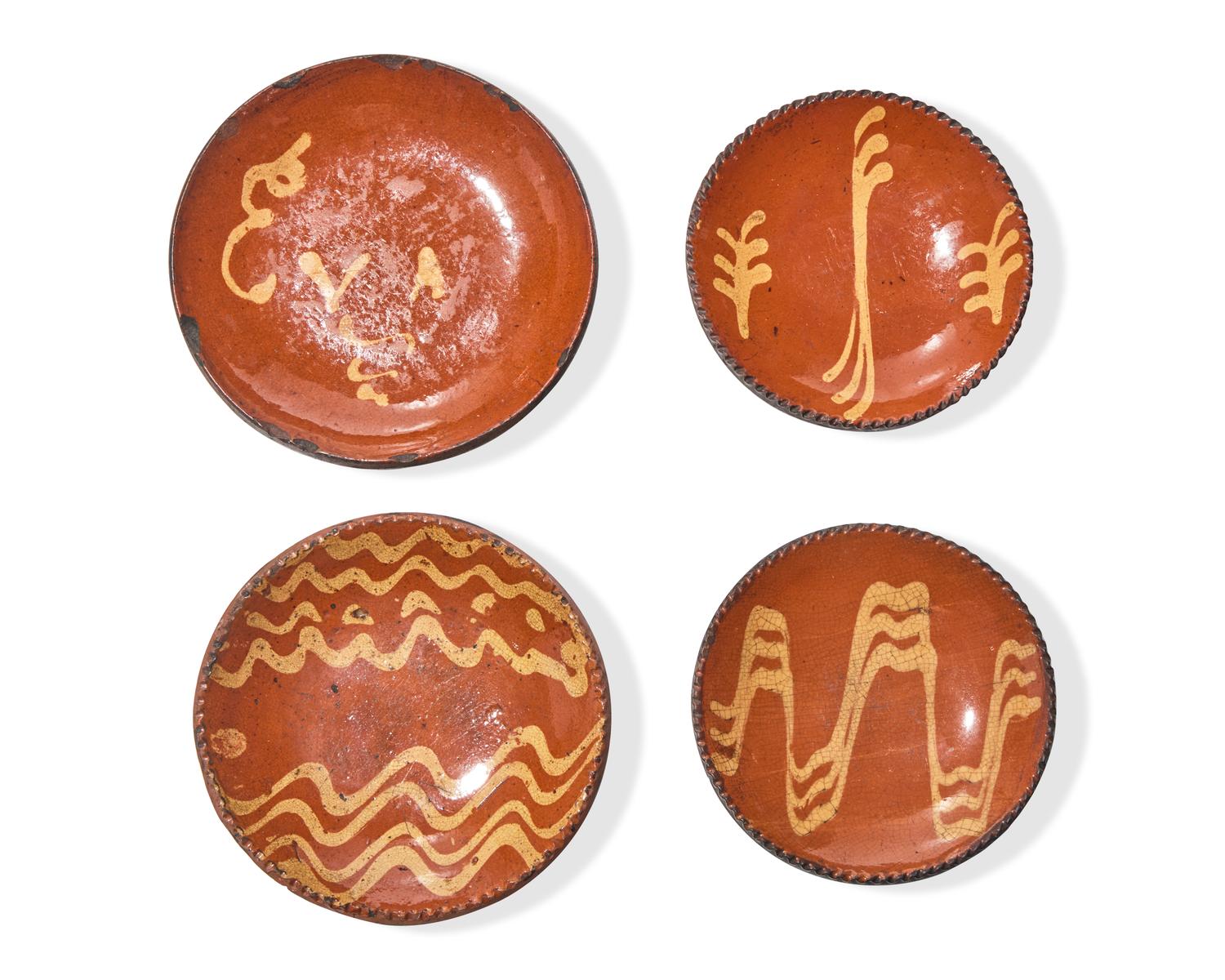 Four Small Slip-Decorated Redware plates, Pennsylvania, 19th Century