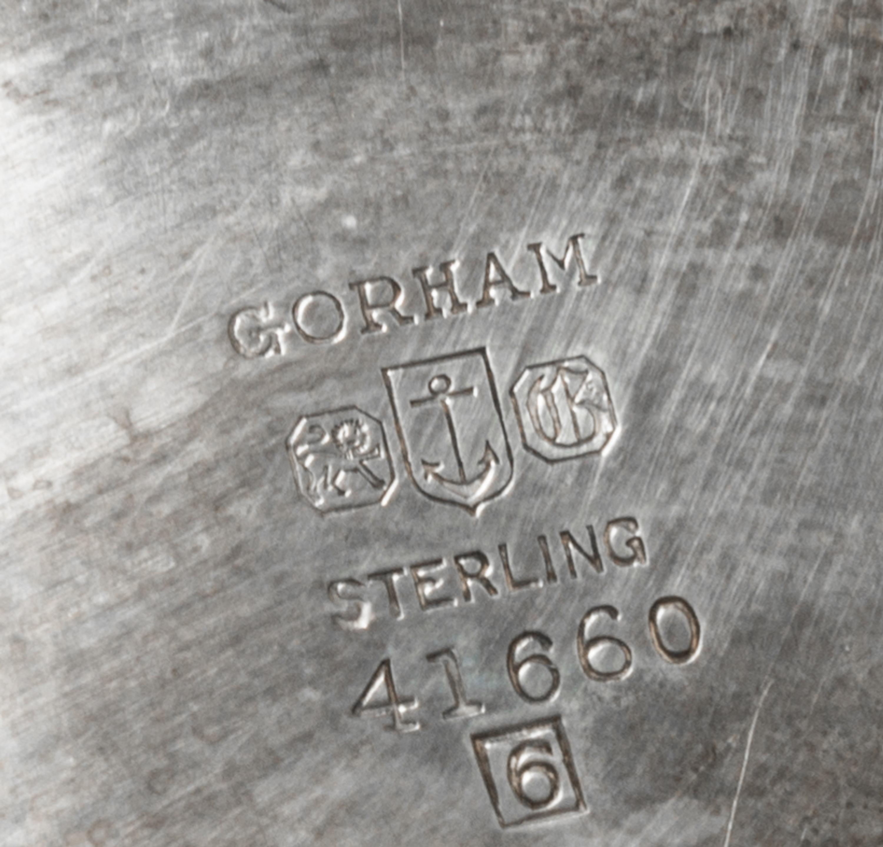 An American Silver "Revere" Bowl, Gorham Mfg. Co., Providence, RI, 1956, the deep circular bowl with a flared rim raised on a short mol