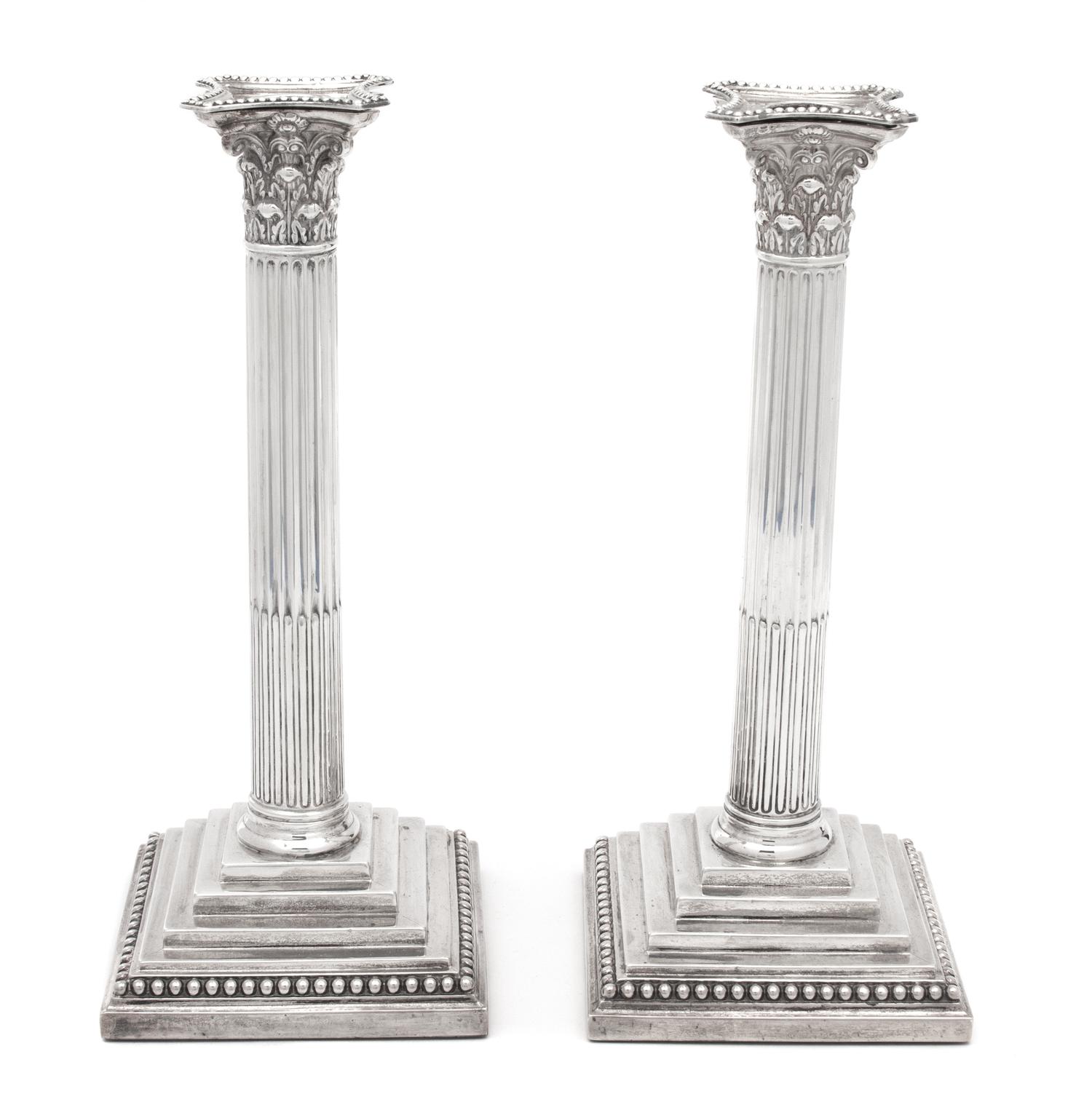 A Pair of English Weighted Silver Columnar Candlesticks, William Hutton & Sons, London, 1890,