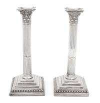 A Pair of English Weighted Silver Columnar Candlesticks, William Hutton & Sons, London, 1890,