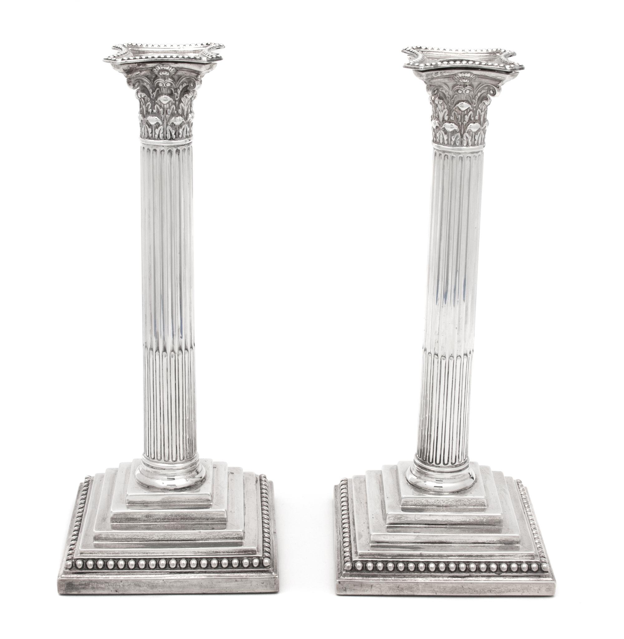A Pair of English Weighted Silver Columnar Candlesticks, William Hutton & Sons, London, 1890,