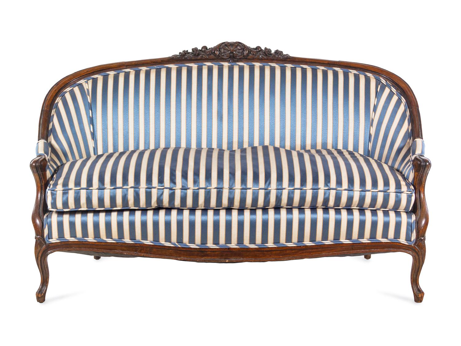 A Louis XV Style Carved Walnut Settee