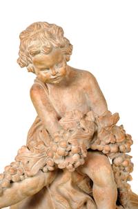 A Pair of Terra Cotta Putti Ornaments