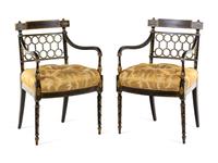 A Pair of Regency Style Gilt and Black Lacquered Armchairs