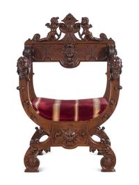 A Renaissance Revival Carved Walnut Savonarola Chair