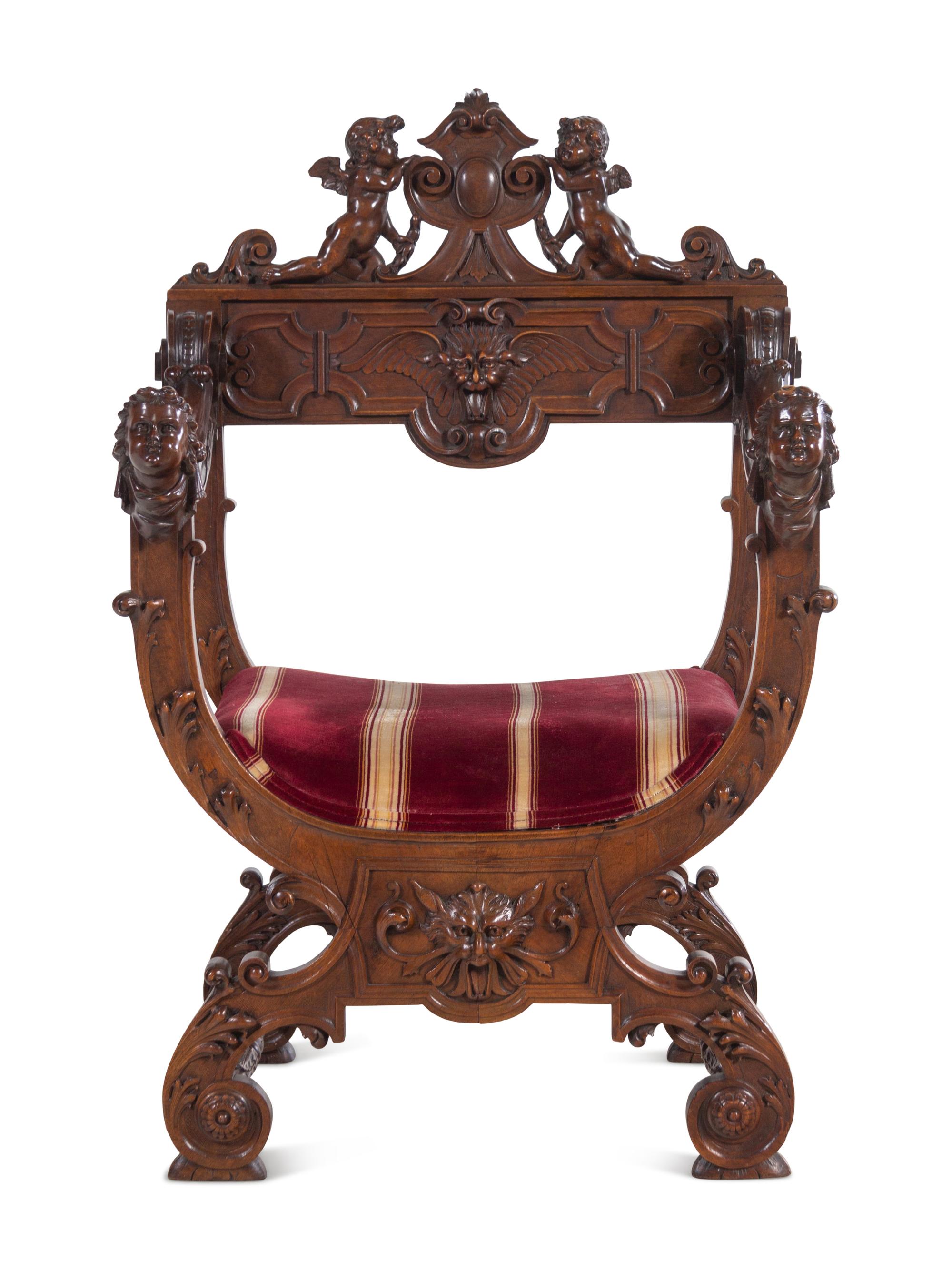 A Renaissance Revival Carved Walnut Savonarola Chair