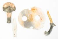 A Group of Eleven Archaic Jade Items Length of largest 14 inches.