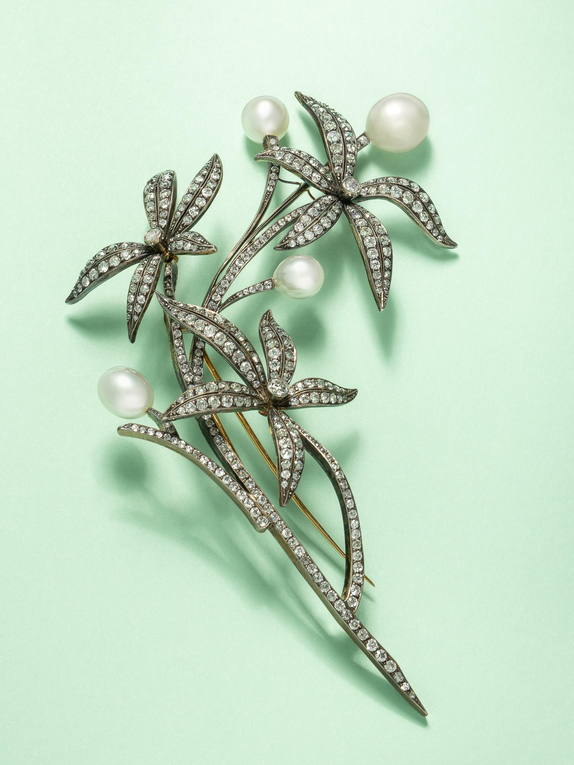 EVELYN CLOTHIER, DIAMOND AND CULTURED PEARL FLOWER BROOCH