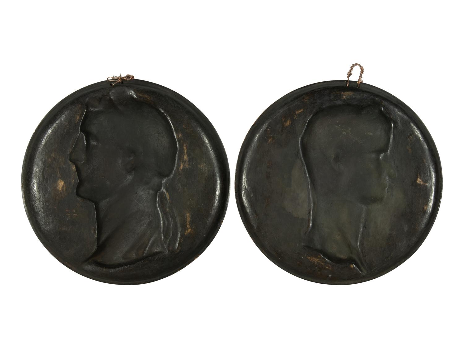 A Pair of Continental Patinated and Parcel Gilt Bronze Plaques of Roman Emperors