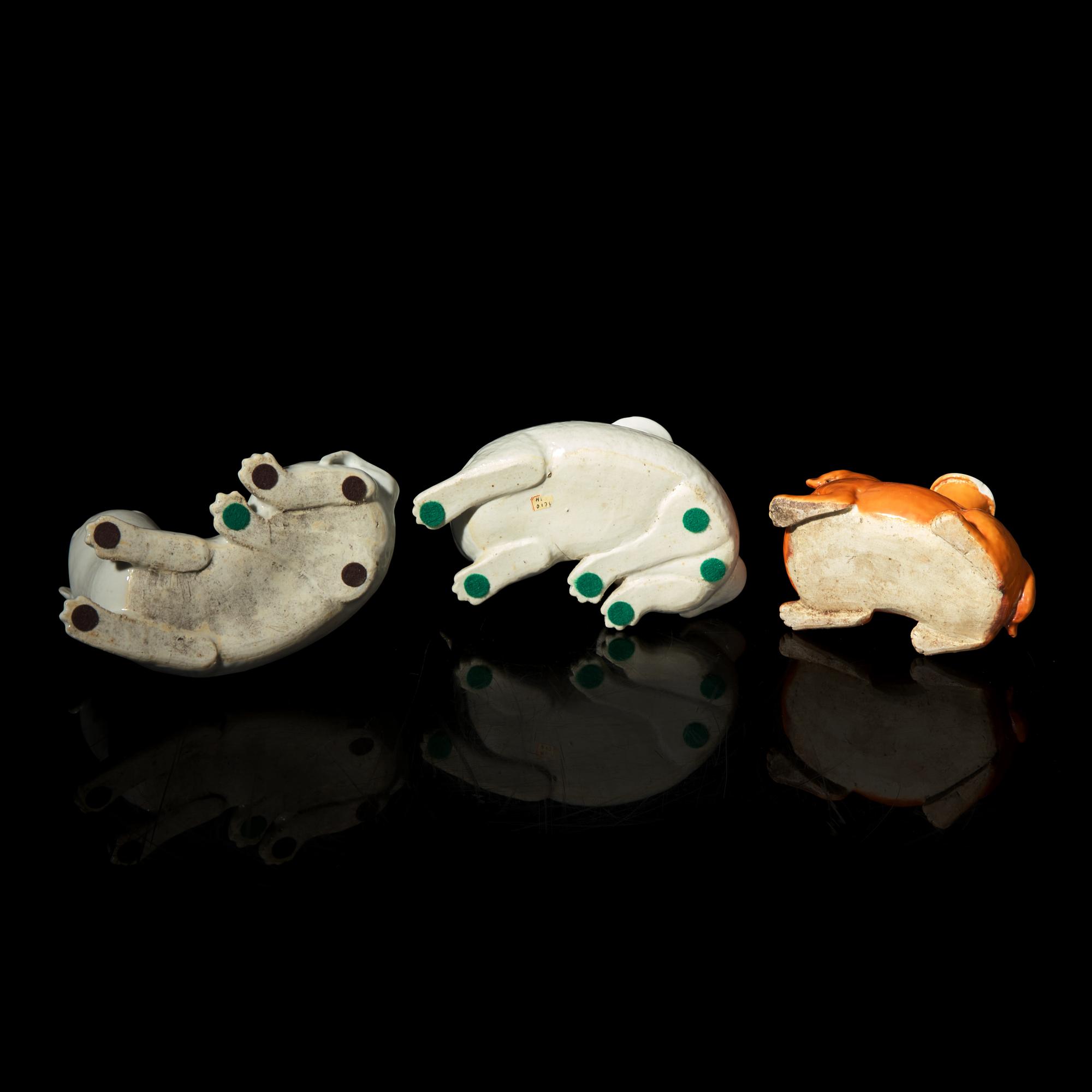 Three Chinese Export Porcelain Dog Candleholders, 19th Century 清晚期 外銷臥犬燭臺三件