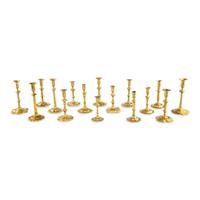 A Group of Sixteen Brass Candlesticks