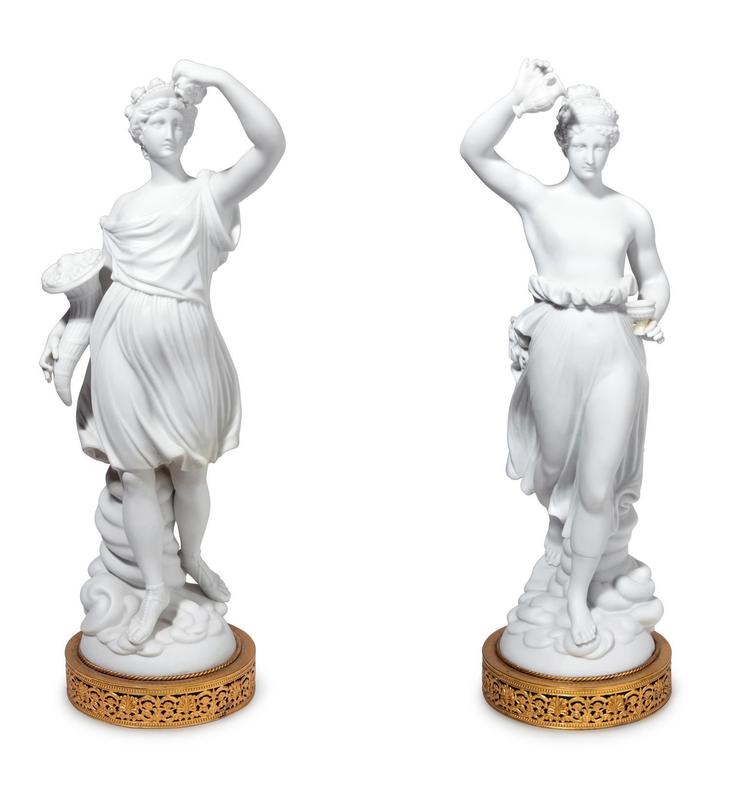A Pair of Gilt Metal Mounted Bisque Porcelain Figures