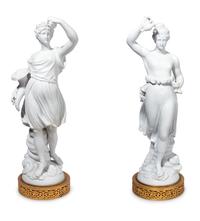 A Pair of Gilt Metal Mounted Bisque Porcelain Figures