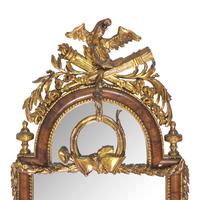 A Pair of Neoclassical Parcel Gilt Walnut Eagle-Decorated Looking Glasses