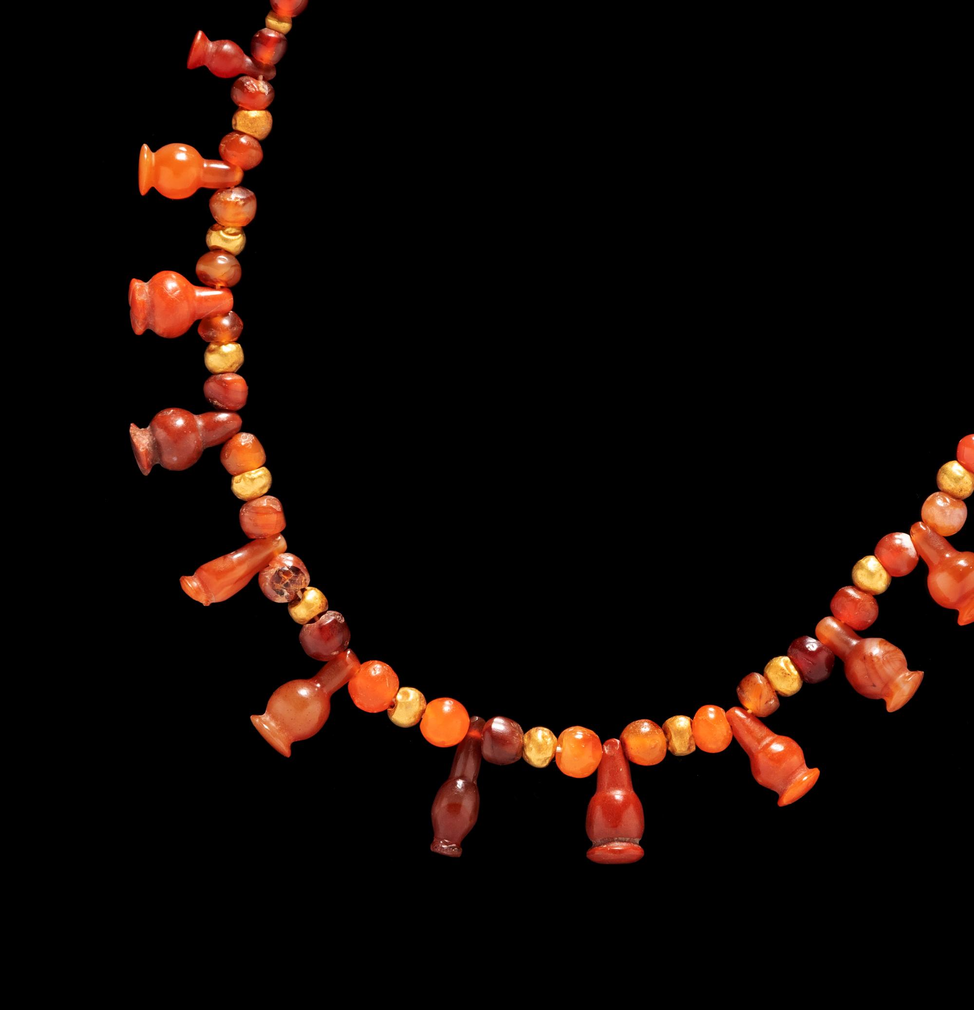 An Egyptian Carnelian and Red Jasper Bead Necklace