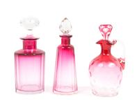 Three Cranberry Glass Cruets Height of tallest 7 inches.