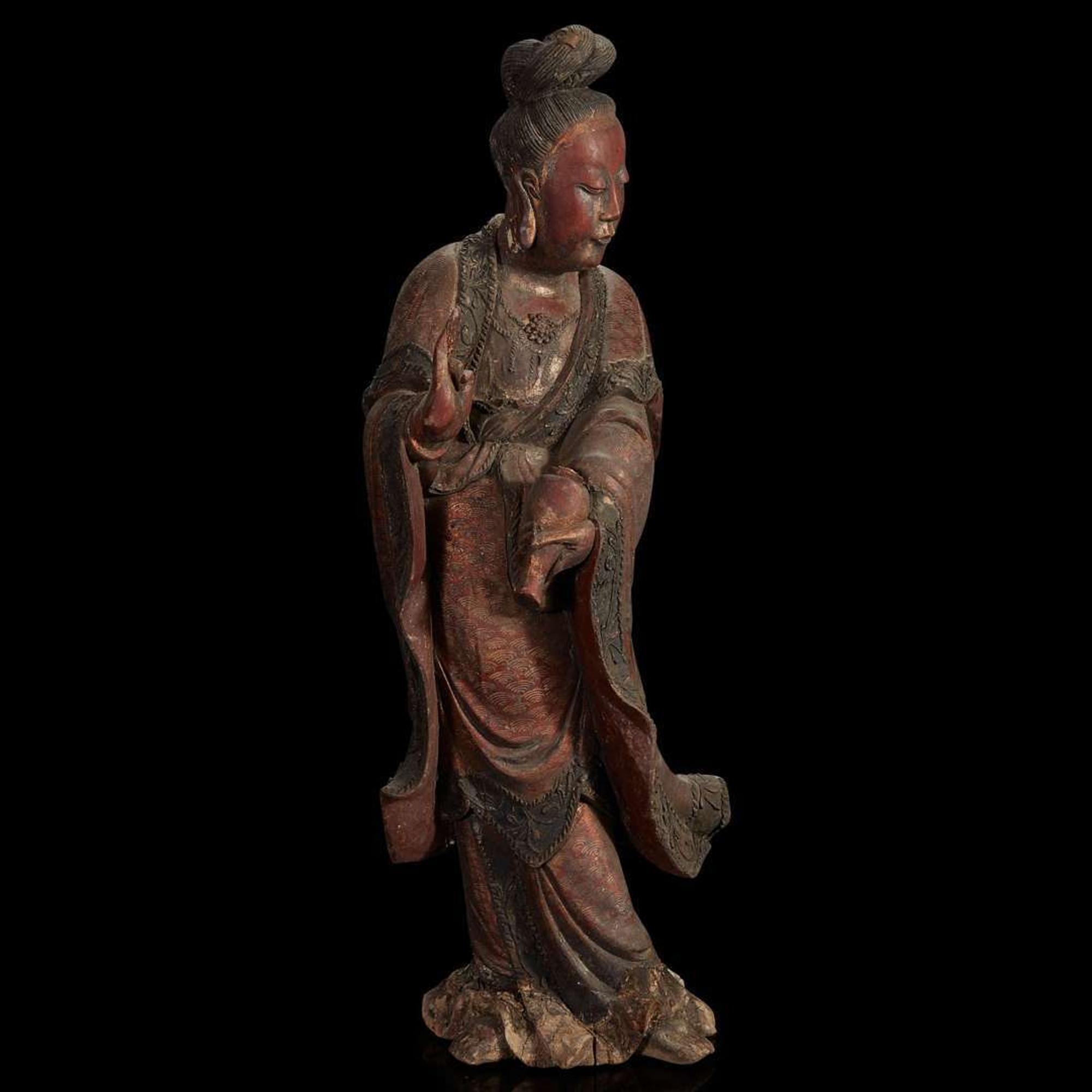 A Chinese carved and lacquered wood figure of Guanyin