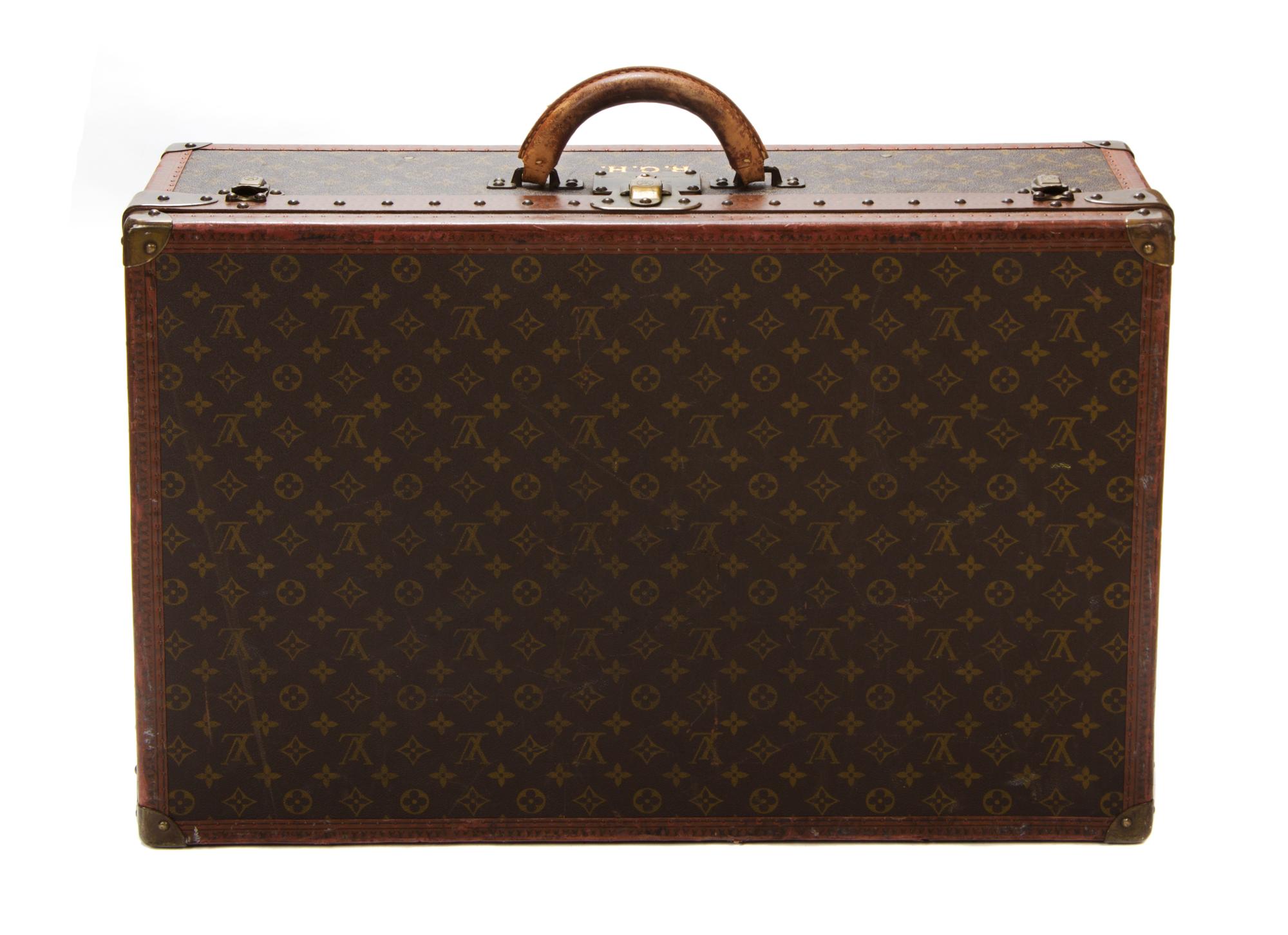 A Louis Vuitton Monogram Canvas Hard-sided Suitcase, 27 1/2 x 18 x 8 inches.