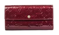 A Louis Vuitton Burgundy Vernis Sarah Wallet, 7.5" x 4.25" x 1".